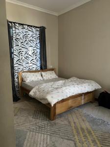 Ένα ή περισσότερα κρεβάτια σε δωμάτιο στο The Black mamba