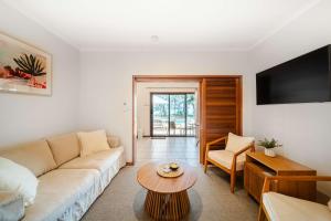 a living room with a couch and a table at Latitude 17 - Suite 3 in South Mission Beach