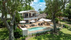 an aerial view of a house with a swimming pool at Latitude 17 - Suite 3 in South Mission Beach