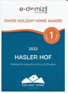 a sign for a hulse holiday home at Haslers Hof in Dinhard