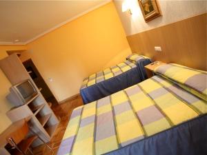 Ein Bett oder Betten in einem Zimmer der Unterkunft El Alfoz de Burgos