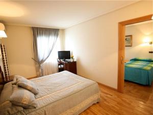 Ein Bett oder Betten in einem Zimmer der Unterkunft El Alfoz de Burgos