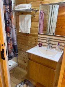 a bathroom with a sink and a mirror at Relax Home Nazareth Rawaqan 2026 منتجع روقان צמר נצרת in Nazareth