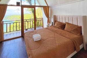 Voodi või voodid majutusasutuse Mentari Ocean View Resort toas