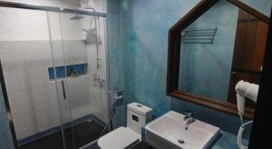 a blue bathroom with a sink and a shower at BAANKONPAI in Pai +59 photos
