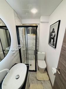 a bathroom with a white toilet and a sink at Apartment in Salou in Salou