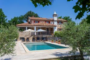 a house with a swimming pool in front of it at House Matija in Svetvinčenat