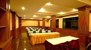 a large room with chairs and tables in it at Phuthong Place in Phayao