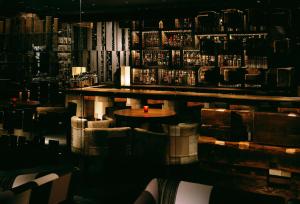 a bar with a table in the middle of a room at Hyatt Regency Kyoto in Kyoto +106 photos