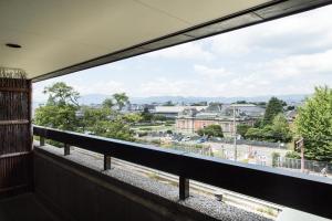 a view of a city from a balcony at Hyatt Regency Kyoto in Kyoto