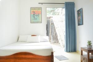 Ένα ή περισσότερα κρεβάτια σε δωμάτιο στο Marakuja House