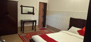 Postel nebo postele na pokoji v ubytování Rose Inn