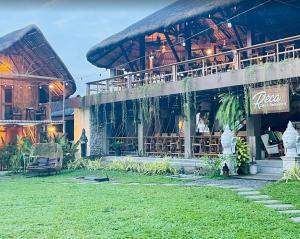 a building with a restaurant with a sign on it at Querencia Resort in Porac