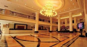a large lobby with a chandelier and a large hall at Datong Hotel in Datong