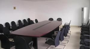 a conference room with a table and chairs at Jinjiang Inn Weihai High Speed Qingdao South Road in Weihai
