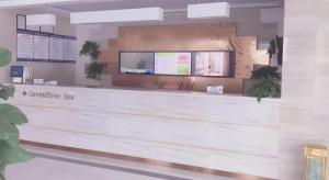 a store front with aitagein sign on the wall at GreenTree Inn Binzhou Bus Station in Dudian