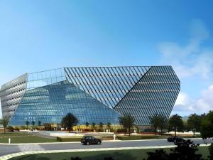 a car parked in front of a glass building at Dusit D2 Binhu Changzhou Hotel in Changzhou