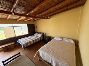 Ένα ή περισσότερα κρεβάτια σε δωμάτιο στο Alojamiento privado en casa de playa