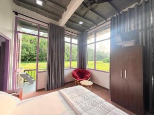 a bedroom with a bed and a large window at Calm Side Villa Hikkaduwa in Hikkaduwa +85 photos