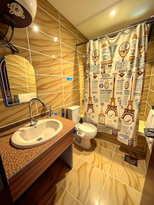 a bathroom with a sink and a shower curtain at Pyramids & SphinX Grand Hotel in Cairo +81 photos