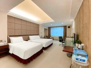 Postel nebo postele na pokoji v ubytování Changchun Zhuozhan Days Hotel + 198 fotografií