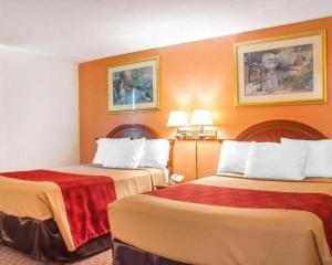 Voodi või voodid majutusasutuse Econo Lodge Cuba I-86 toas