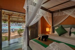 Postel nebo postele na pokoji v ubytování Cloudz Sigiriya