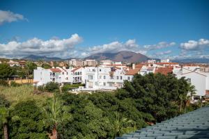 a view of a city with buildings and trees at A & G Sabinillas in San Luis de Sabinillas +36 photos