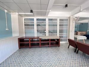 an empty room with a table and chairs in it at บ้านแม่เกสต์เฮ้าส์ Bann Mae in That Phanom