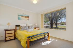 Ένα ή περισσότερα κρεβάτια σε δωμάτιο στο Rooms Jandakot