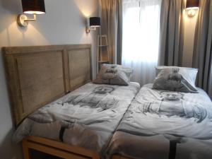 Postel nebo postele na pokoji v ubytování BnB City