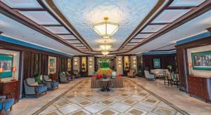 a lobby of a hotel with a large ceiling at Jin Jiang Nanjing Hotel in Nanjing