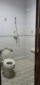 a bathroom with a toilet and a shower at Haad Yao Bayview in Koh Phangan