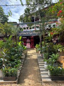a garden shop with a sign that reads plants and flowers at Xing Retreat & Spa Măng Đen in Kon Plong