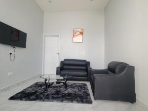 a living room with a couch and a coffee table at MARIGOLD APARTMENTS in Salama Park in Lusaka