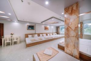 Ένα ή περισσότερα κρεβάτια σε δωμάτιο στο Seoul Motel