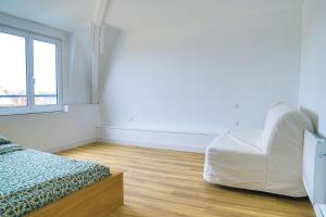 Postel nebo postele na pokoji v ubytování Le Clery Aeroport Disney transfert + 6 fotografií