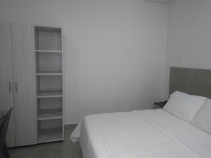 Hotel Boutique Santorini Class客房内的一张或多张床位