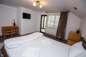 Ένα ή περισσότερα κρεβάτια σε δωμάτιο στο Teona guest