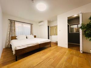 Ένα ή περισσότερα κρεβάτια σε δωμάτιο στο お宿 岸ノ四季