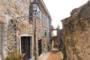 an alley in an old stone building at The Old Ship in Costarainera