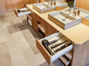 a bathroom with two sinks and two counters at Y-HOTEL - Vacation STAY 22285v in Hiroshima +27 photos