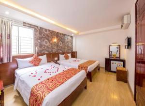 Ένα ή περισσότερα κρεβάτια σε δωμάτιο στο Lesoleil Hotel +32 φωτογραφίες