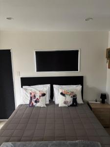 Ένα ή περισσότερα κρεβάτια σε δωμάτιο στο Rangiputa Retreat