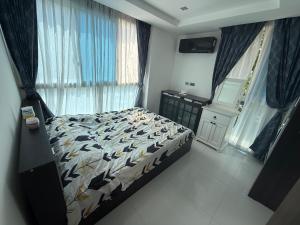 Voodi või voodid majutusasutuse SERENITY Wongamant CONDO toas +2 fotot