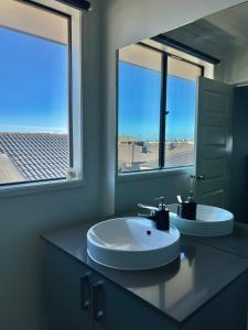 a bathroom with two sinks and a large mirror at Mahzan on Kilcunda - Ensuite 3 in Truganina +16 photos