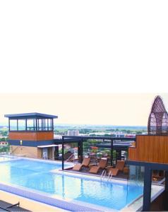a large swimming pool on top of a building at La Grande Residence 1BR Corner unit Phase 2-710 in Angeles