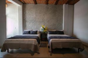 Ένα ή περισσότερα κρεβάτια σε δωμάτιο στο OYO Hotel Casa Zaragoza