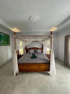 Postel nebo postele na pokoji v ubytování Sekumpul Guest House