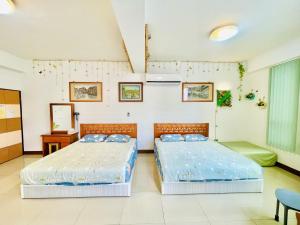 Una cama o camas en una habitación de Lohas-artist B&B